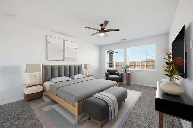 a bedroom with a bed couch and flat screen tv