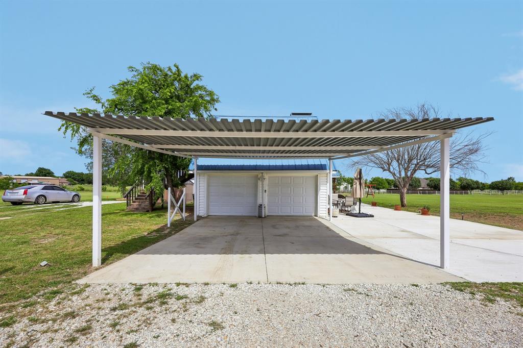 331 Radecke Road Krum, TX 76249 - Photo 35 of 40 Dedicated two-car carport with a corrugated metal roof