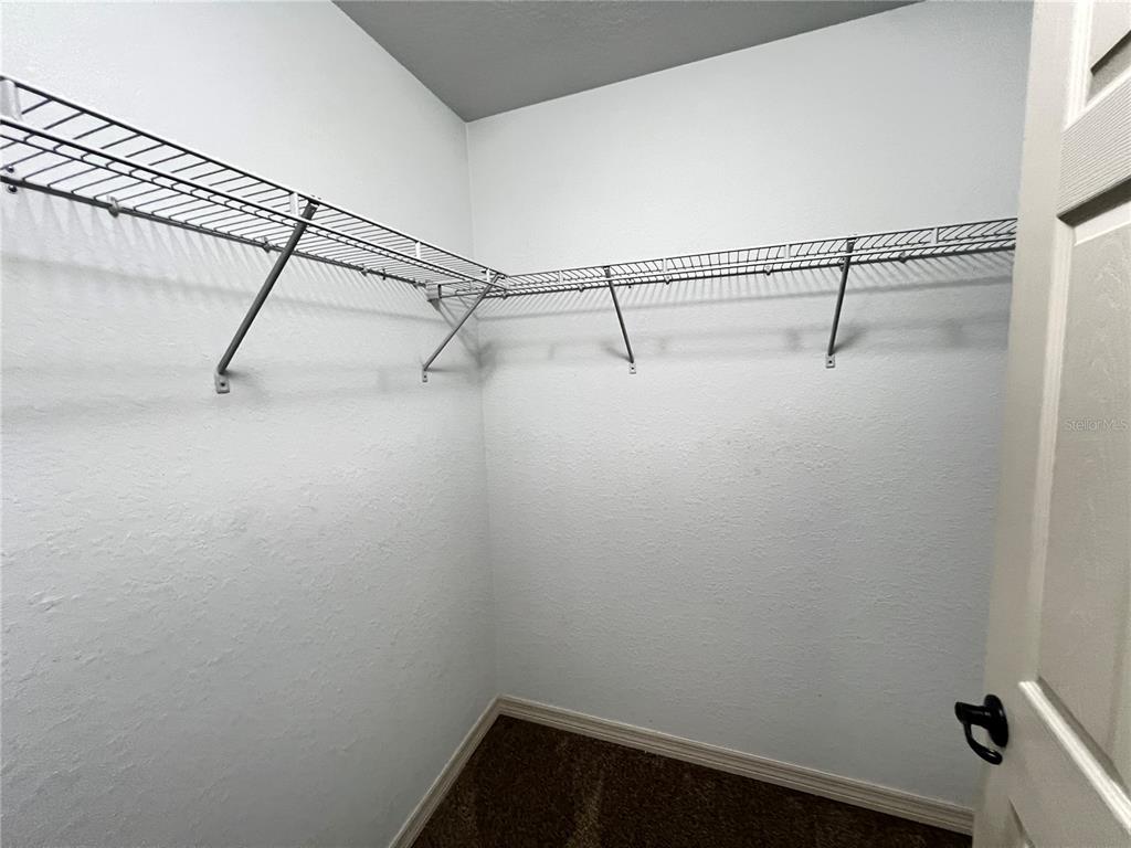 2427 Southwest 168th Loop Ocala, FL 34473 - Photo 19 of 21 a view of a room with racks on the wall