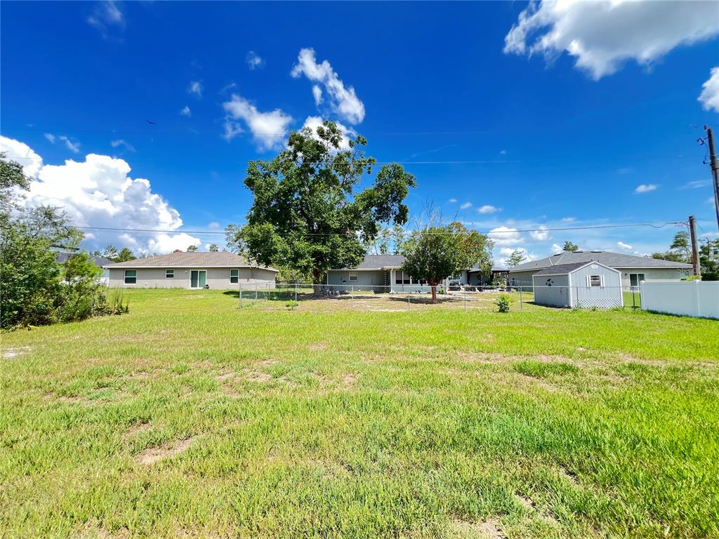 2427 Southwest 168th Loop Ocala, FL 34473 - Photo 6 of 21 a view of a house with a yard