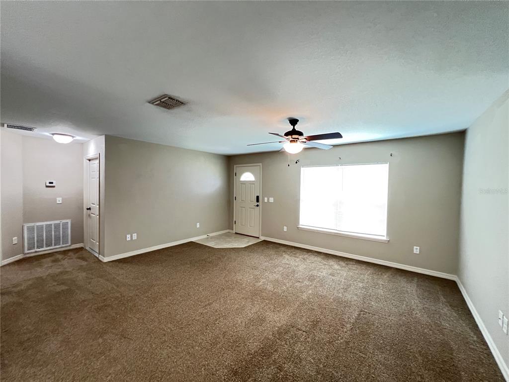 2427 Southwest 168th Loop Ocala, FL 34473 - Photo 7 of 21 a view of an empty room with a window