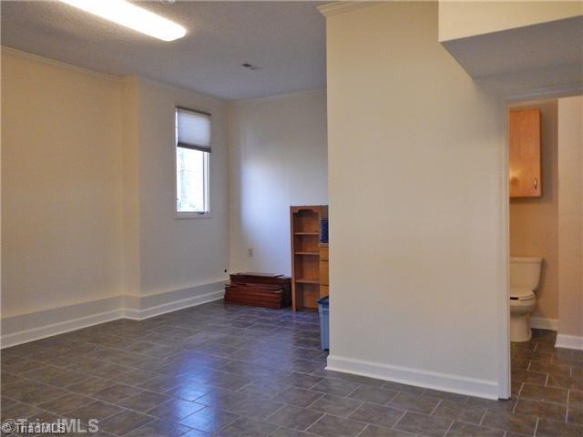 310 Kirk Road Greensboro, NC 27455 - Photo 12 of 16 Bonus. The downstairs bonus has plenty of storage space as well as a half bath.