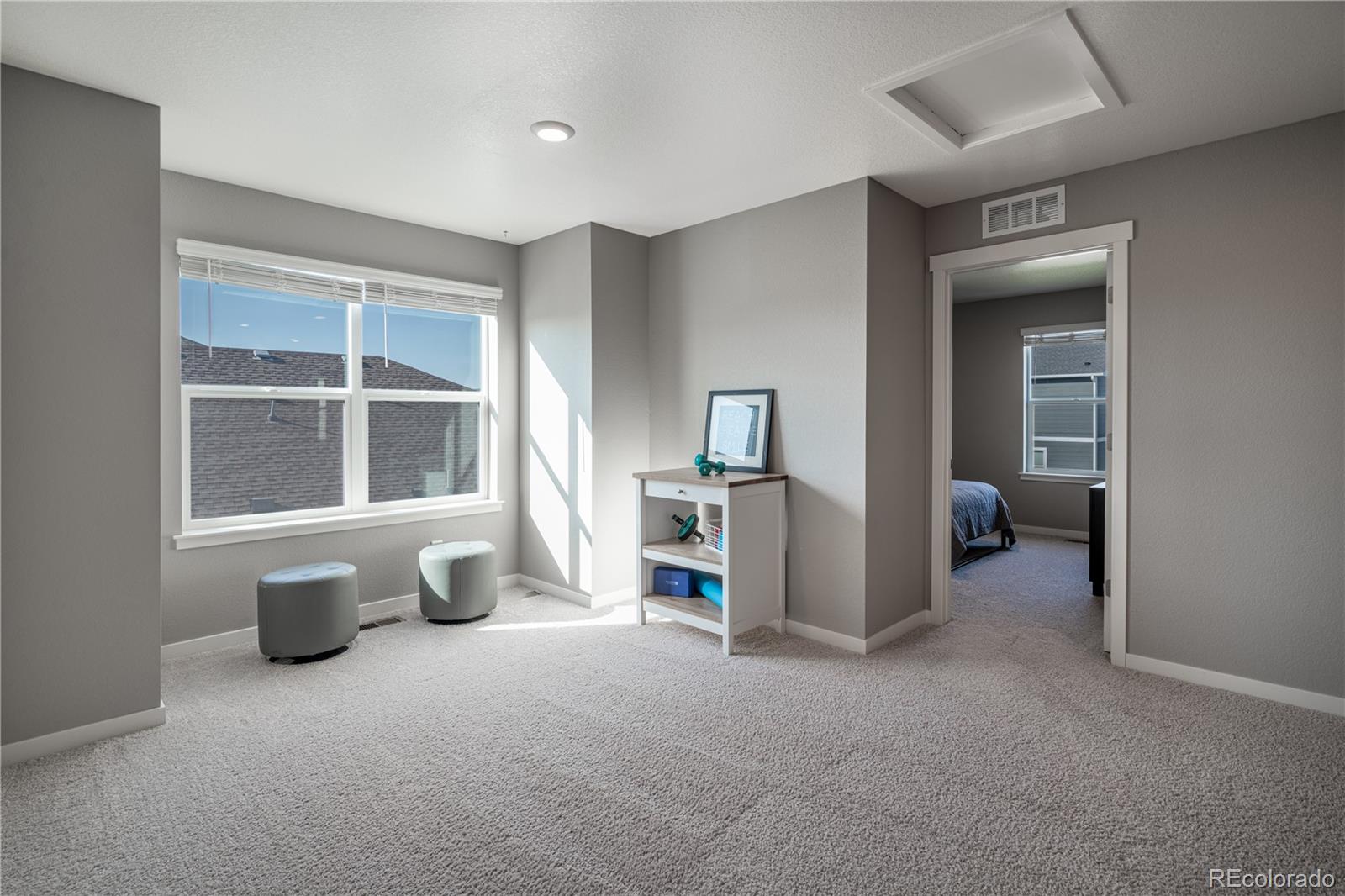 1521 Sun River Road Berthoud, CO 80513 - Photo 11 of 23 a view of a livingroom with furniture and windows