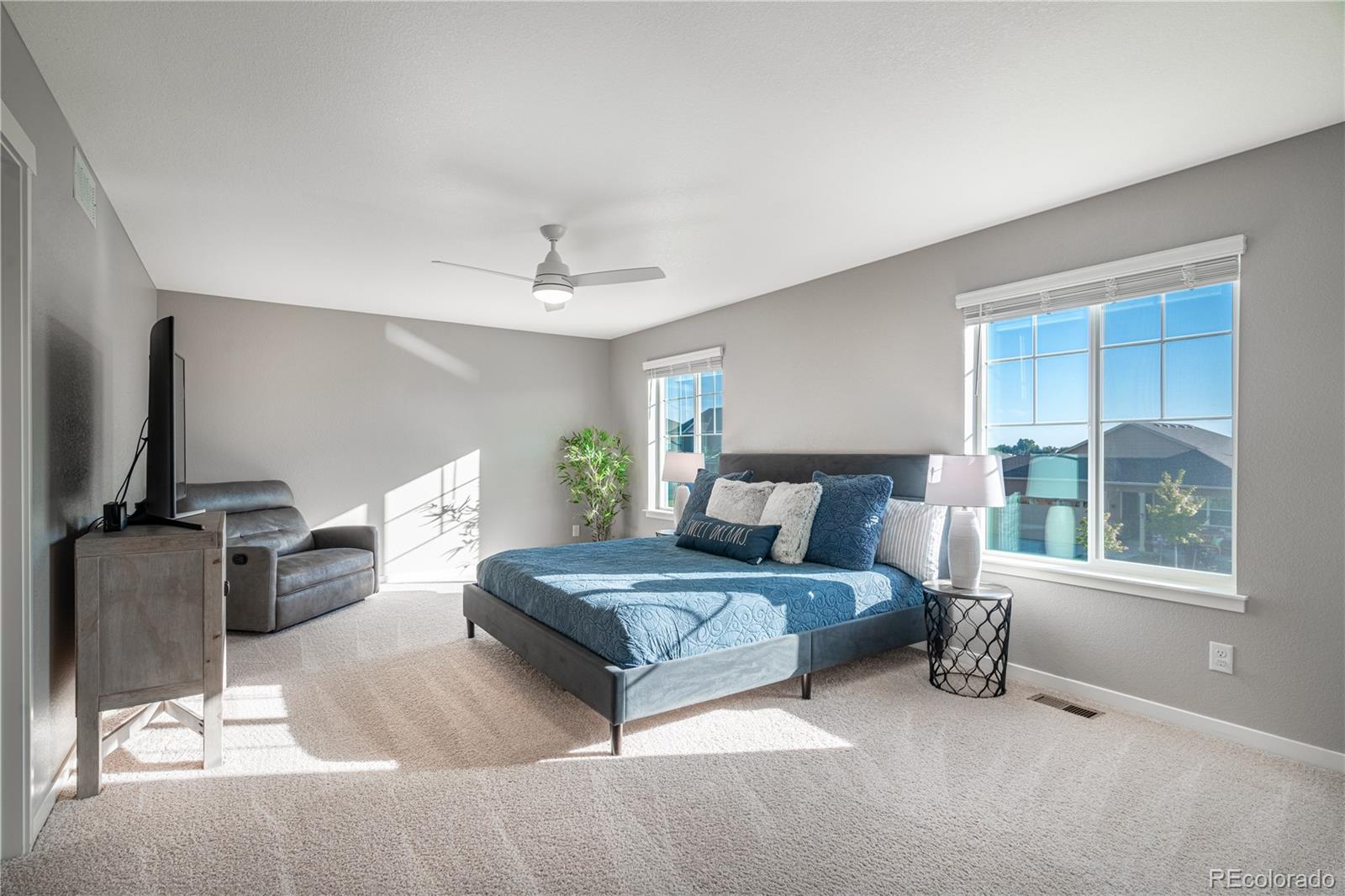 1521 Sun River Road Berthoud, CO 80513 - Photo 12 of 23 a bedroom with a bed and large window