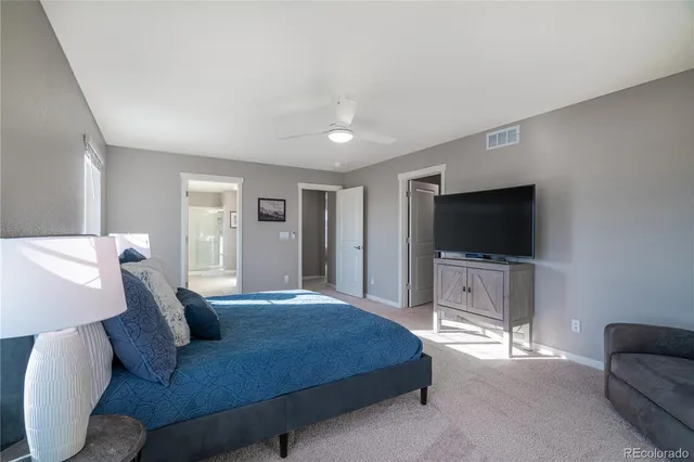 a bathroom with a sink a shower a mirror and a shower