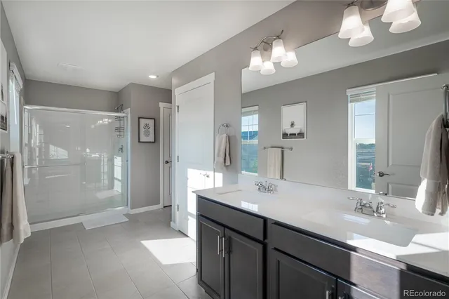 a room with a table chairs and a workspace