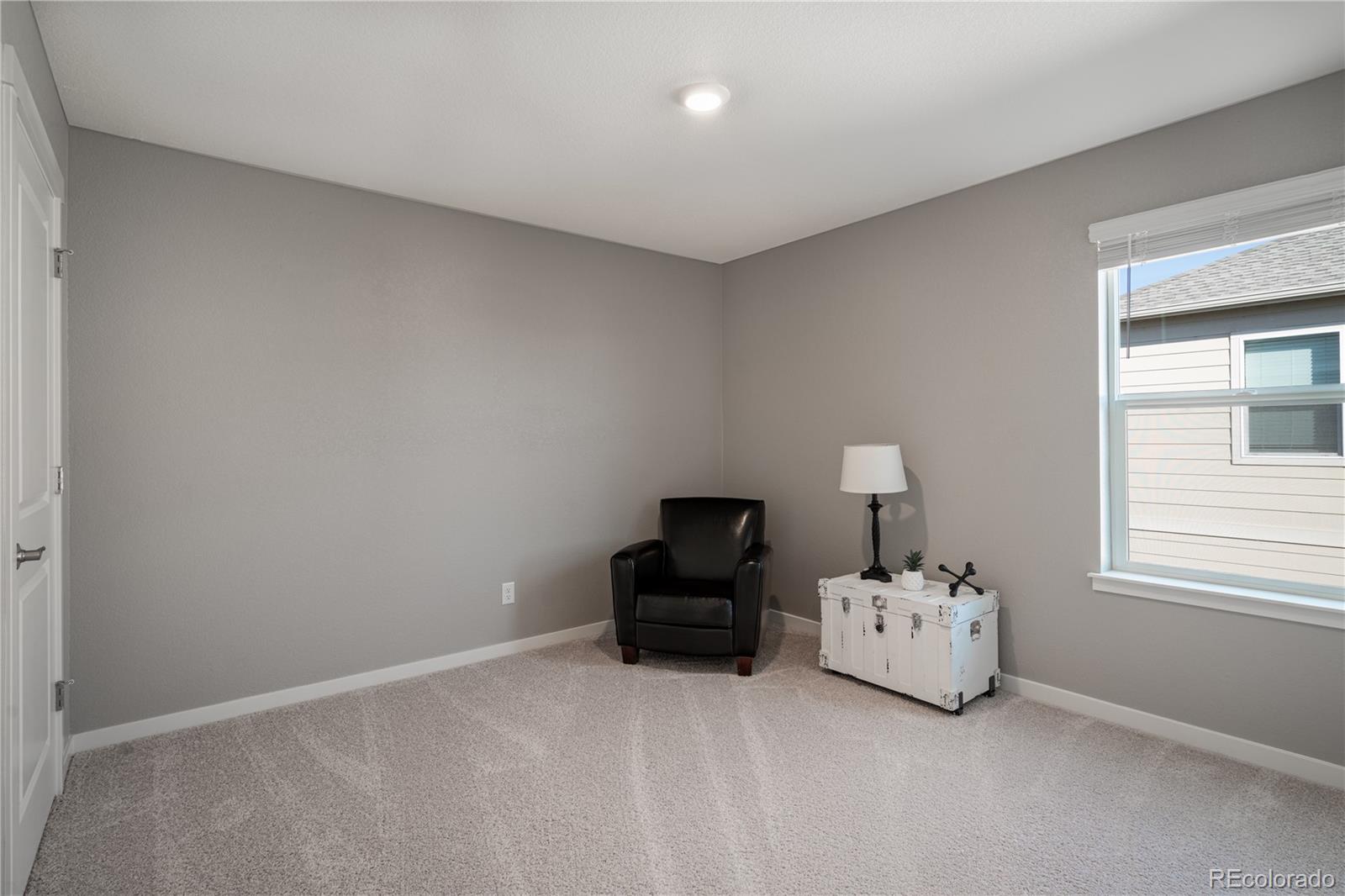 1521 Sun River Road Berthoud, CO 80513 - Photo 18 of 23 a bedroom with a bed and window