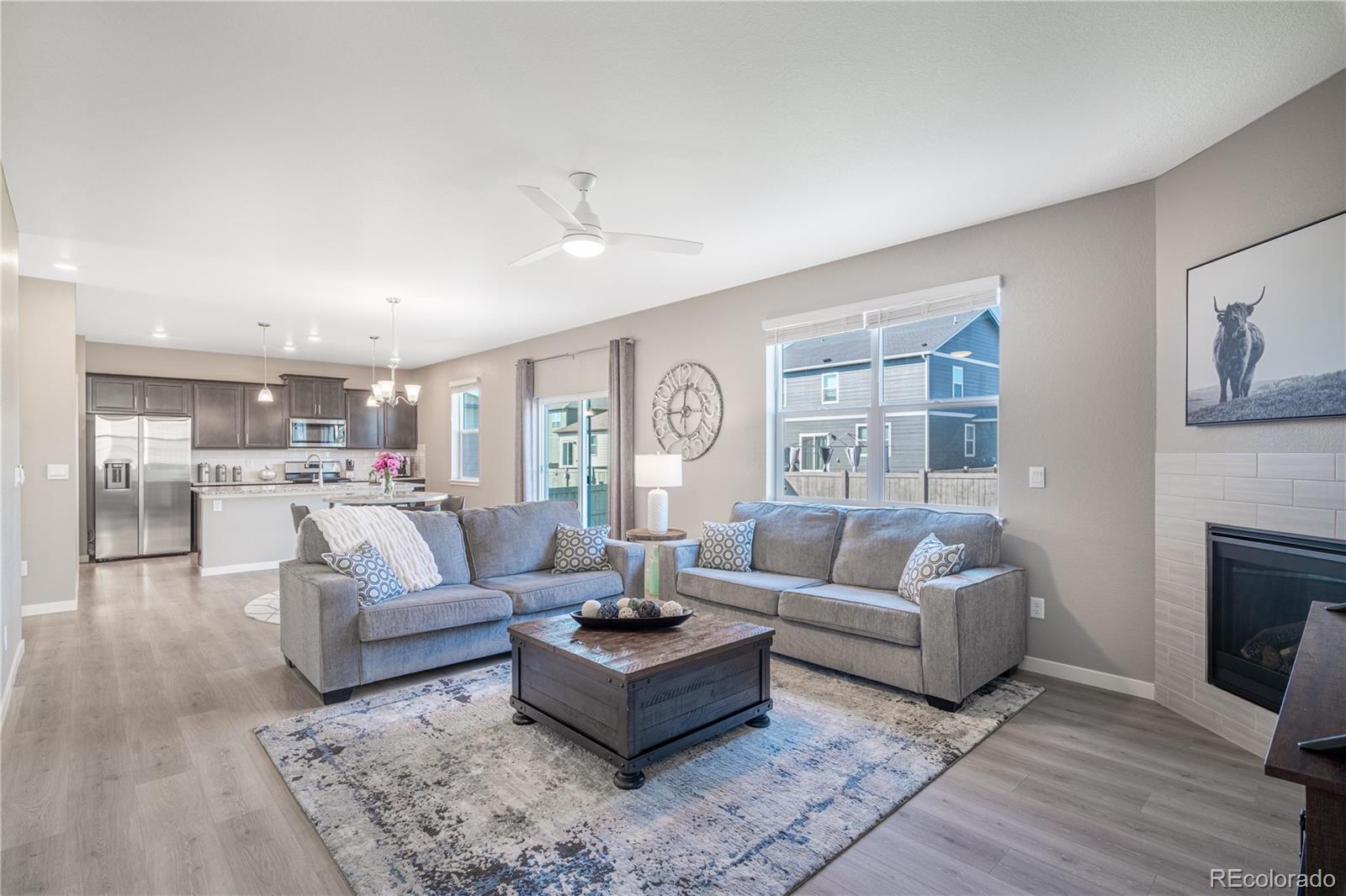 1521 Sun River Road Berthoud, CO 80513 - Photo 8 of 23 a living room with furniture and a fireplace