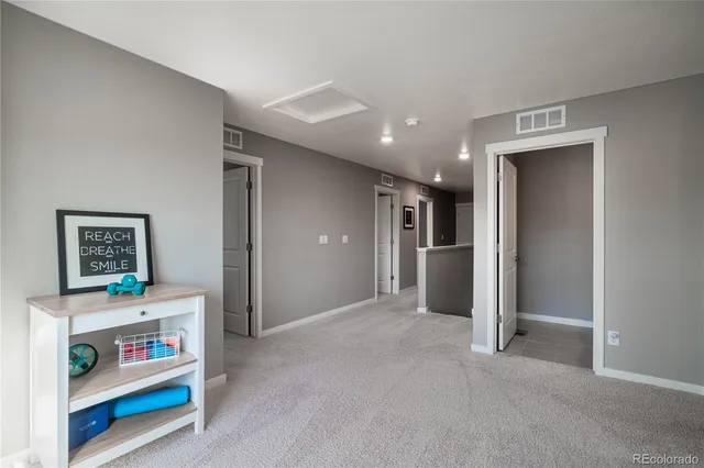 a view of a livingroom with furniture and windows