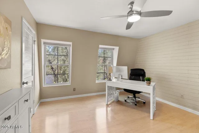 a view of a bedroom with furniture and window