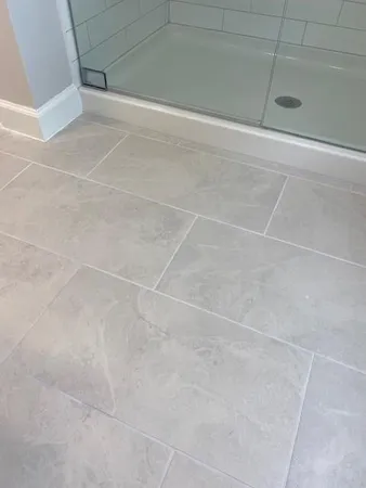 a bedroom with bed and a window