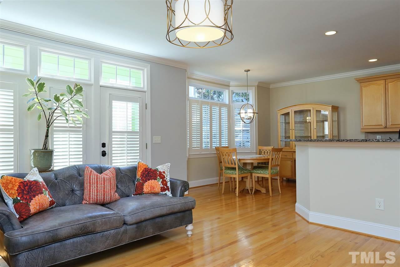 1164 Harp Street Raleigh, NC 27604 - Photo 14 of 25 a living room with furniture a dining table and a window