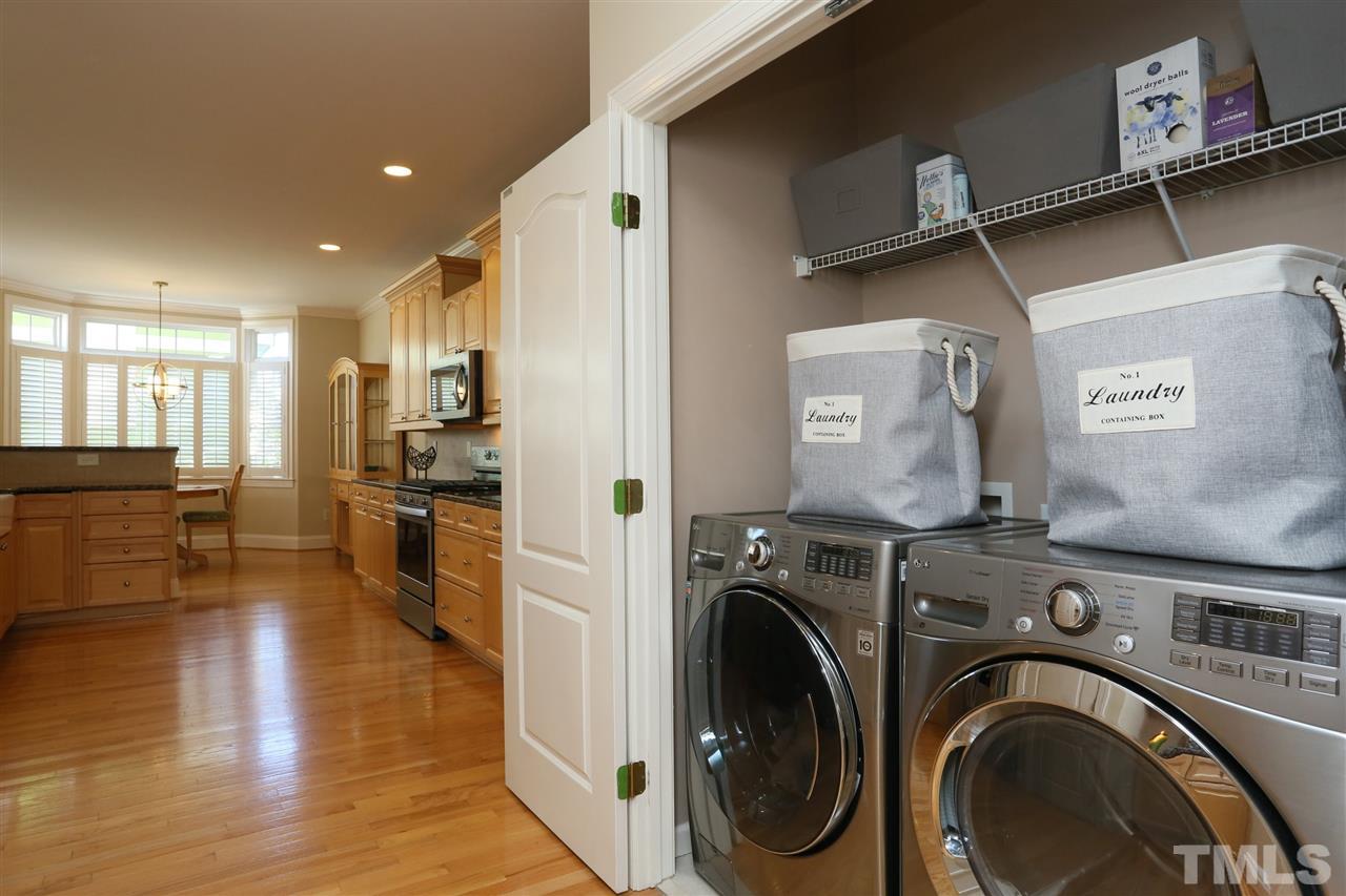 1164 Harp Street Raleigh, NC 27604 - Photo 15 of 25 a view of a kitchen with furniture and wooden floor