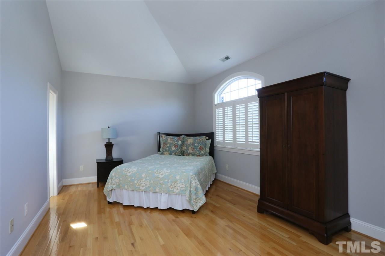 1164 Harp Street Raleigh, NC 27604 - Photo 19 of 25 a bedroom with a bed and window