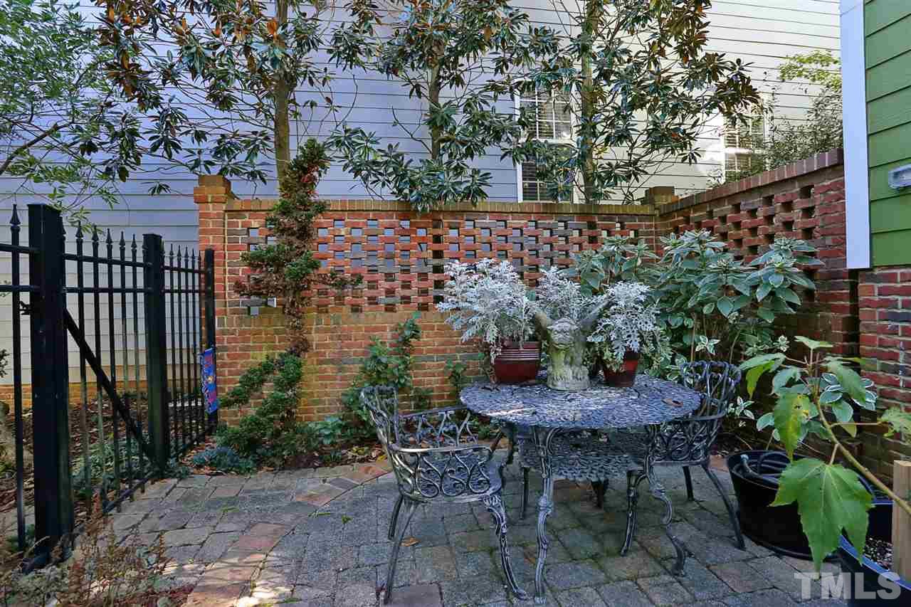 1164 Harp Street Raleigh, NC 27604 - Photo 23 of 25 a backyard of a house with table and chairs