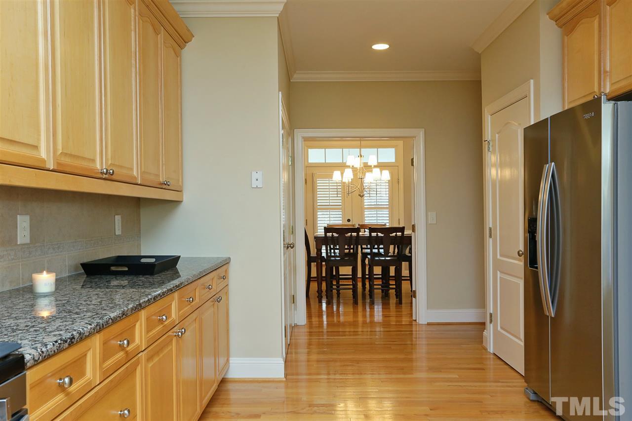 1164 Harp Street Raleigh, NC 27604 - Photo 9 of 25 a kitchen with stainless steel appliances granite countertop a refrigerator and a stove top oven