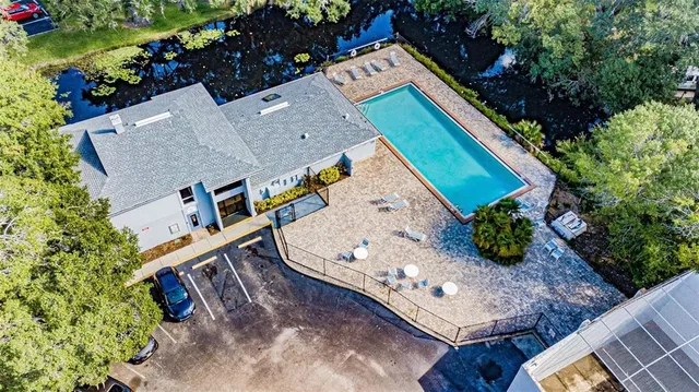 an aerial view of a house with a yard