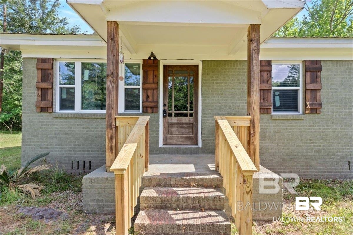 29397 Loper Road Loxley, AL 36551 - Photo 3 of 22 Entrance to property with a porch and brick siding
