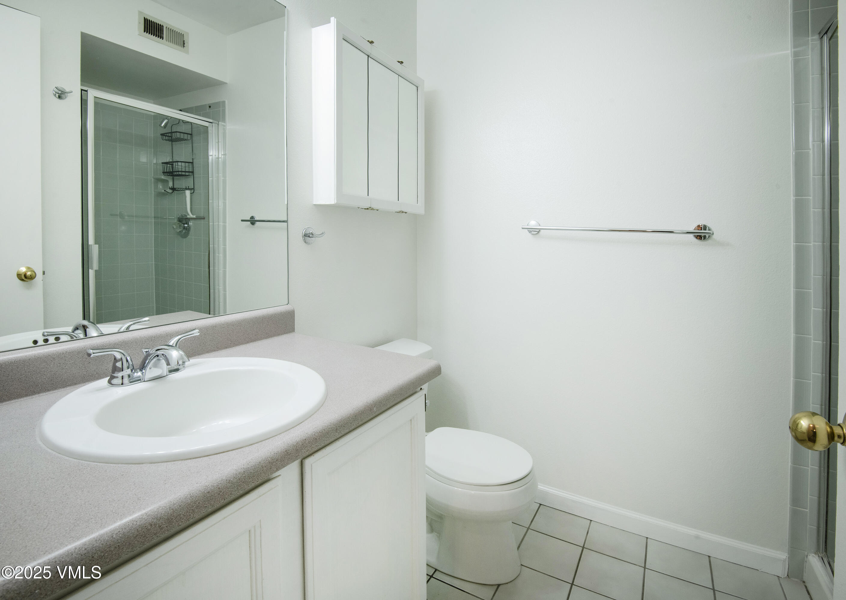 34999 Highway 6, Unit O303 Edwards, CO 81632 - Photo 14 of 35 a bathroom with a sink a toilet and mirror