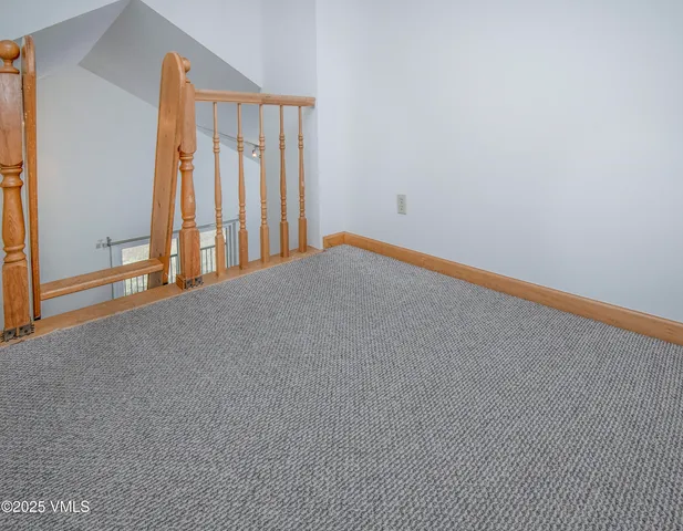 a front view of a residential houses with yard and trees