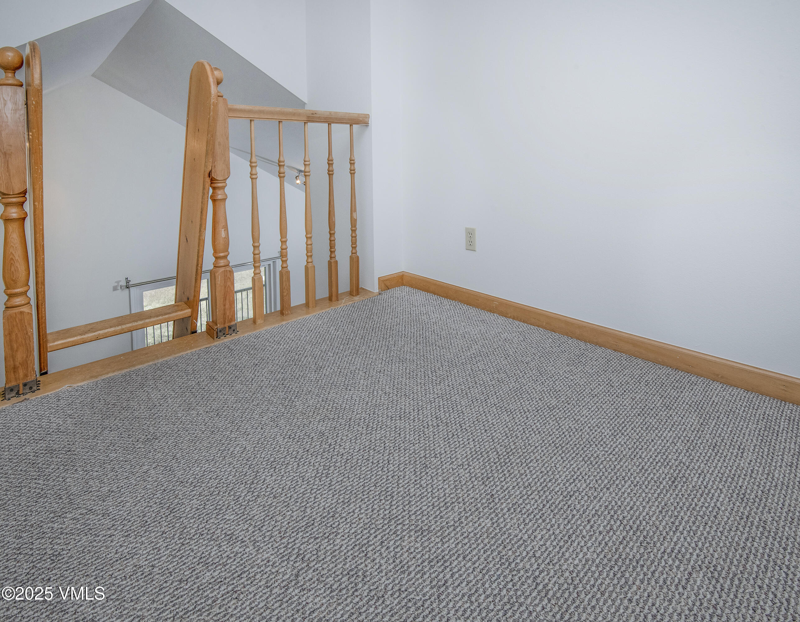 34999 Highway 6, Unit O303 Edwards, CO 81632 - Photo 27 of 35 a view of a room with a wooden floor and a window