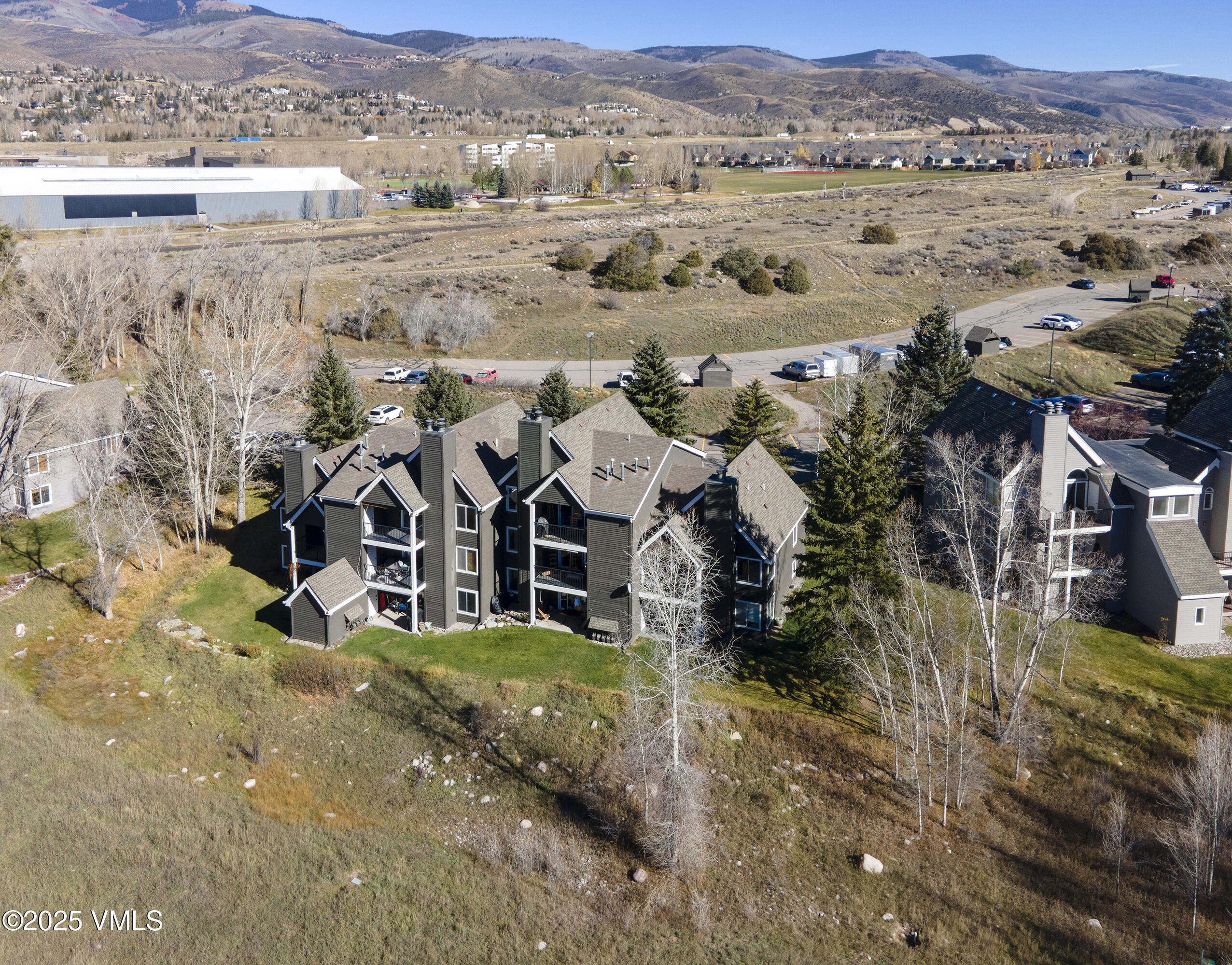 34999 Highway 6, Unit O303 Edwards, CO 81632 - Photo 31 of 35 an aerial view of residential houses with outdoor space and trees
