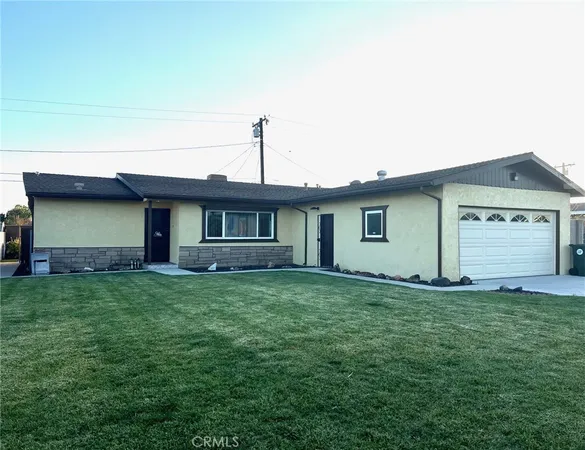 a front view of a house with yard