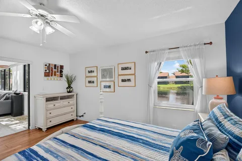 a bedroom with furniture and a window