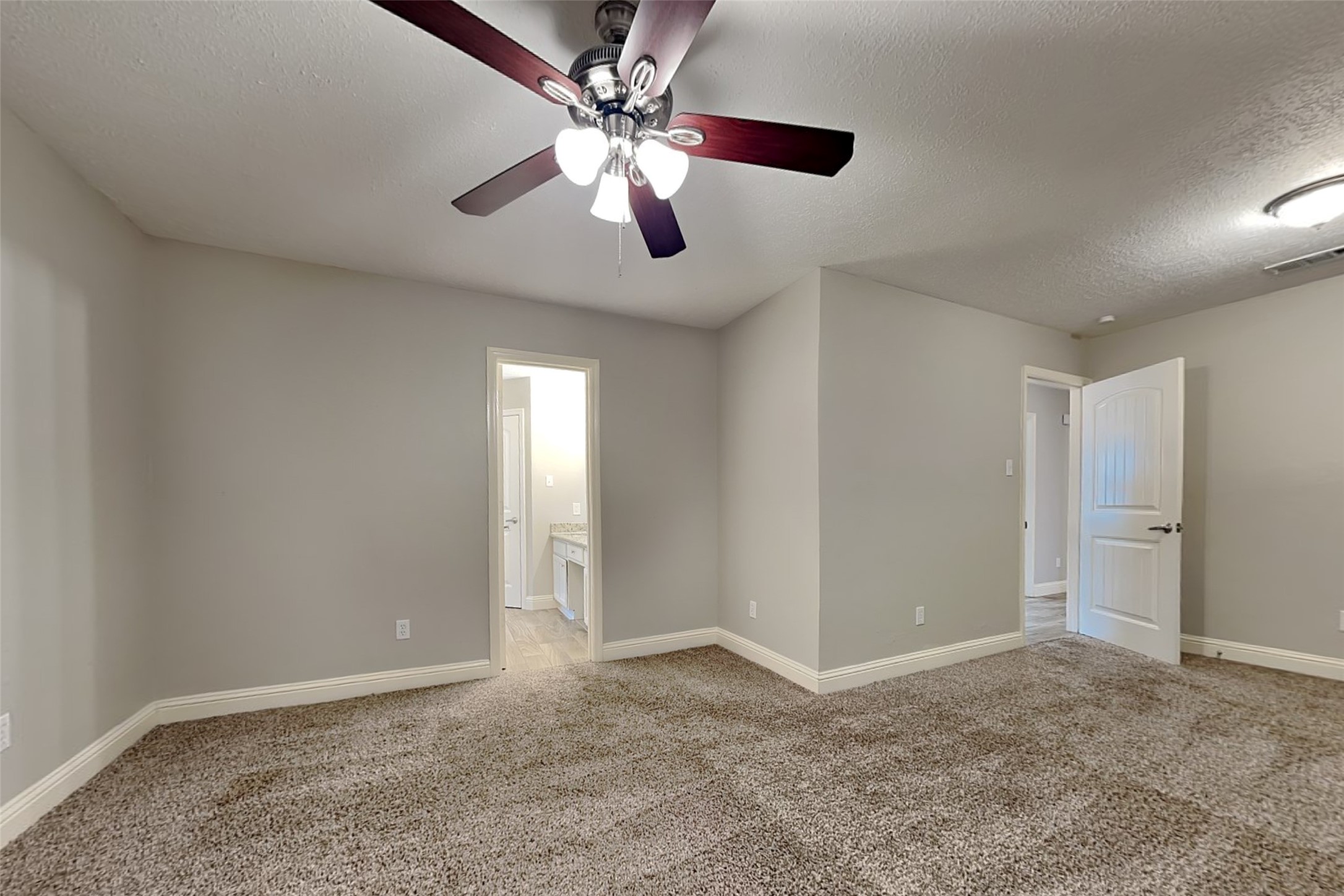 19902 Pinefield Court Humble, TX 77338 - Photo 13 of 23 a view of an empty room with a fan