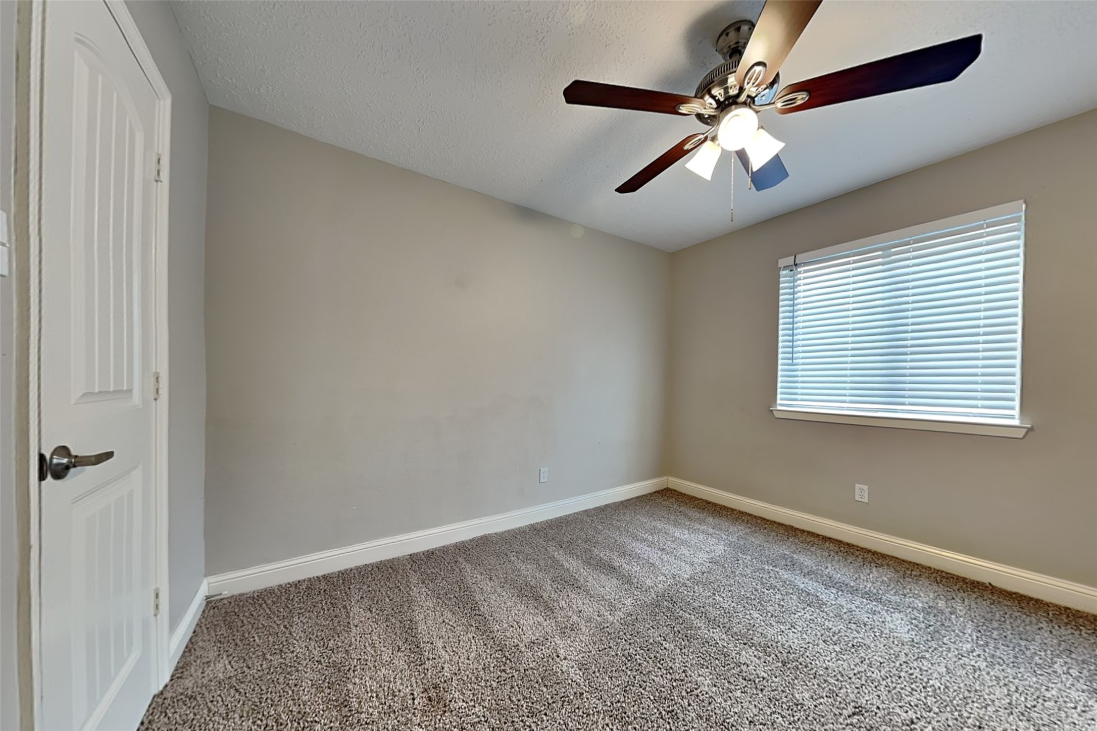 19902 Pinefield Court Humble, TX 77338 - Photo 17 of 23 a view of an empty room with a window