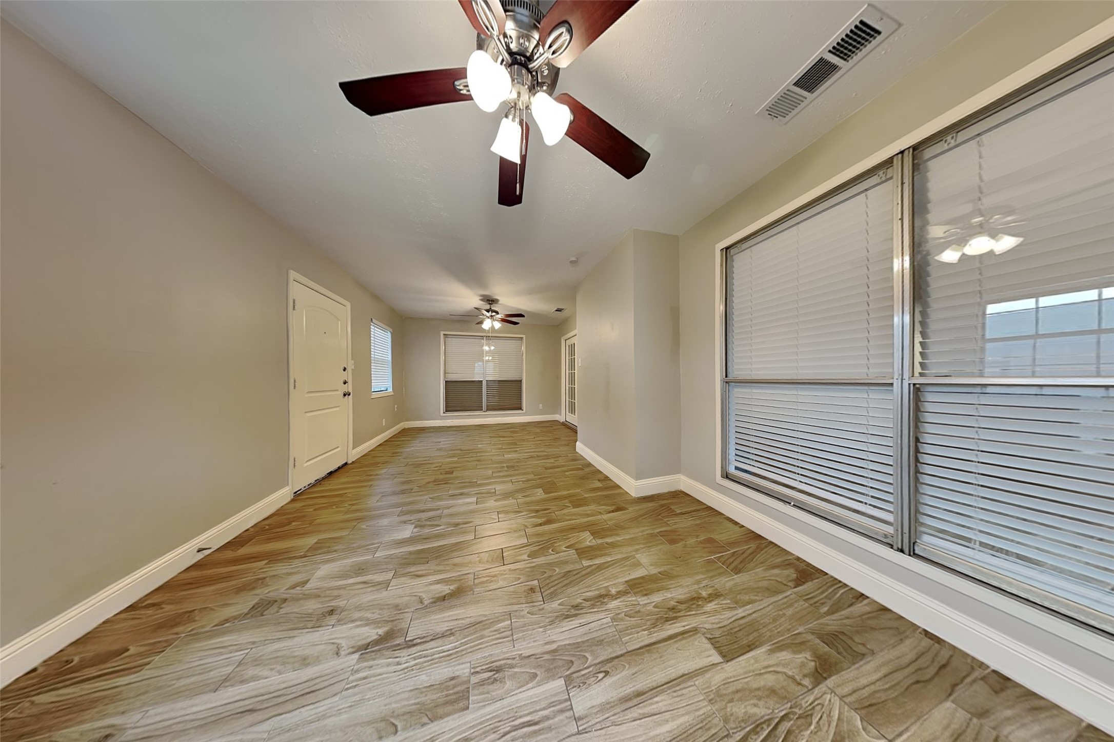 19902 Pinefield Court Humble, TX 77338 - Photo 19 of 23 a view of empty room with wooden floor