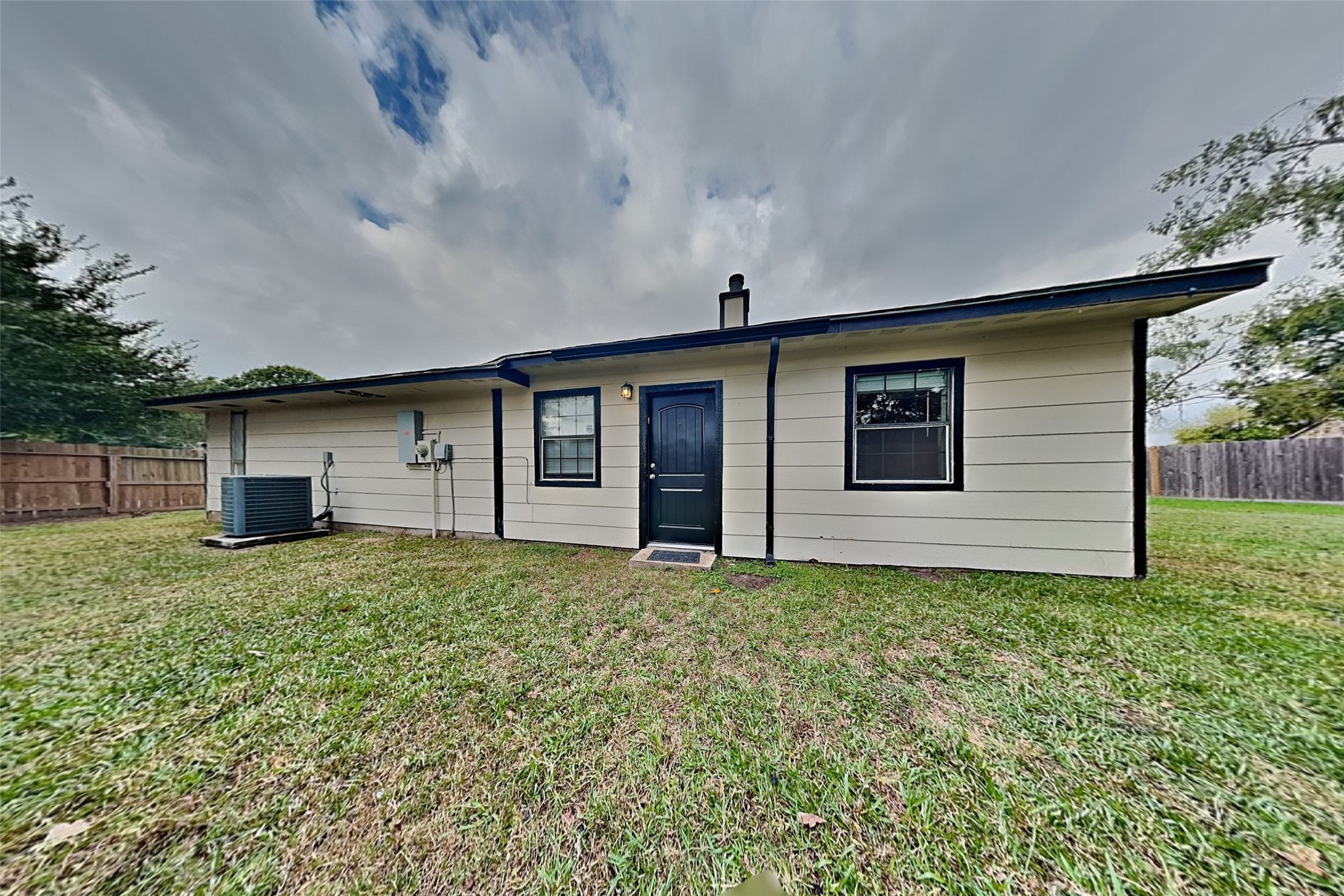 19902 Pinefield Court Humble, TX 77338 - Photo 22 of 23 a house that has a big yard large trees with wooden fence