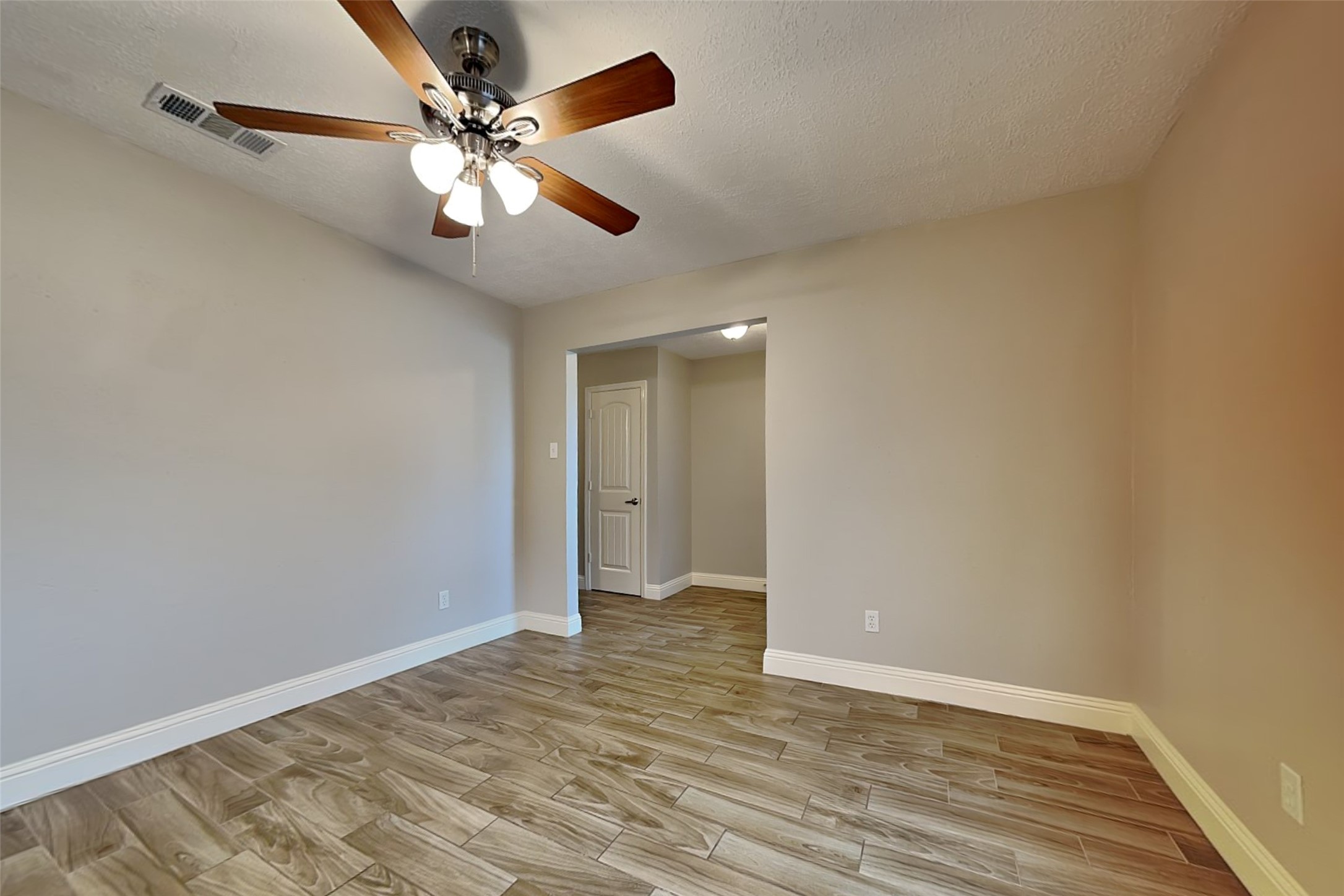 19902 Pinefield Court Humble, TX 77338 - Photo 5 of 23 wooden floor in an empty room