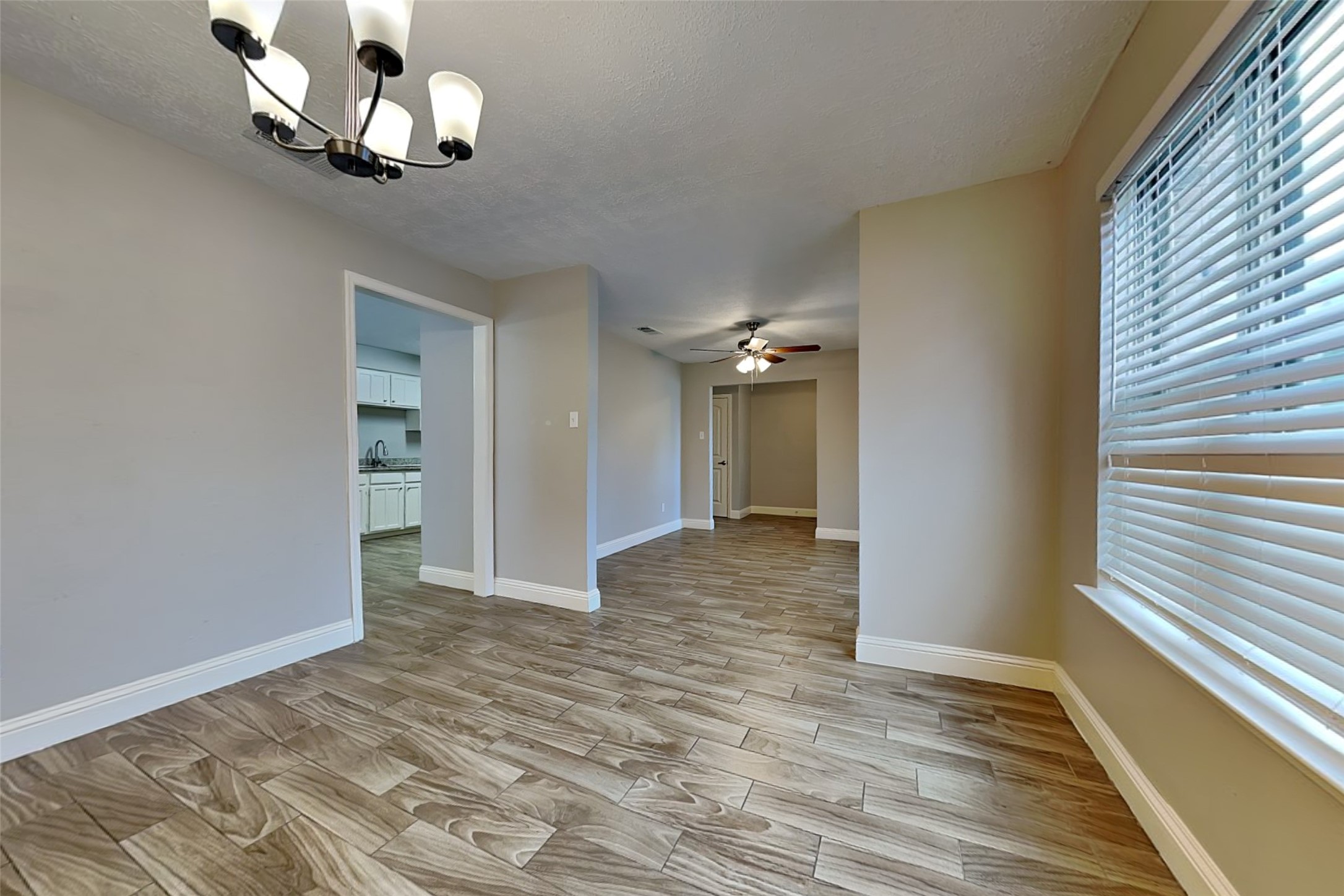 19902 Pinefield Court Humble, TX 77338 - Photo 10 of 23 a view of a livingroom with a chandelier
