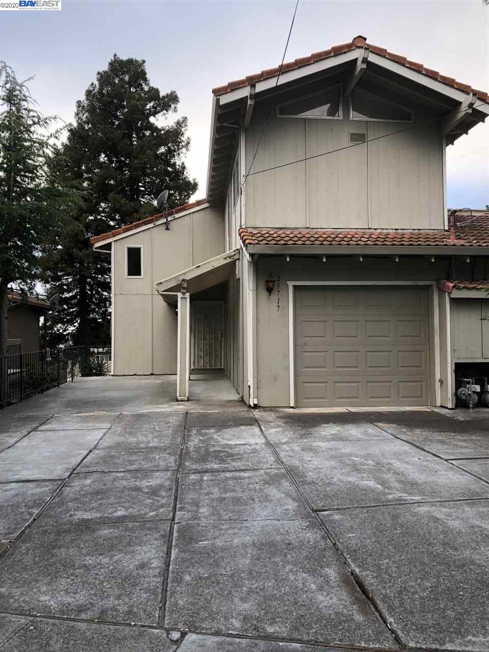 a front view of a house with garage