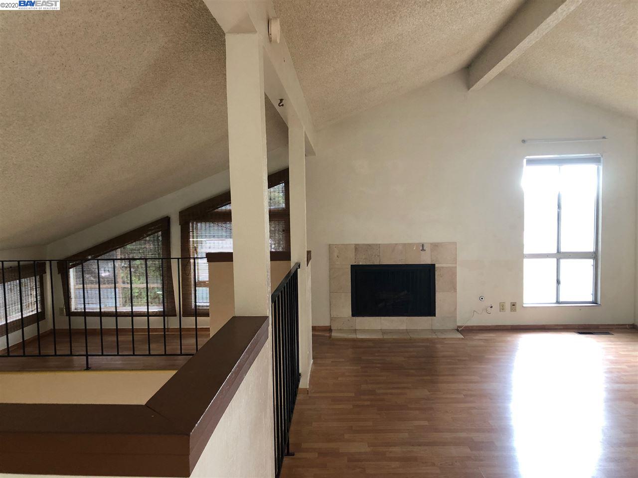 25717 Spring Drive Hayward, CA 94542 - Photo 13 of 13 a view of a livingroom with wooden floor and a fireplace
