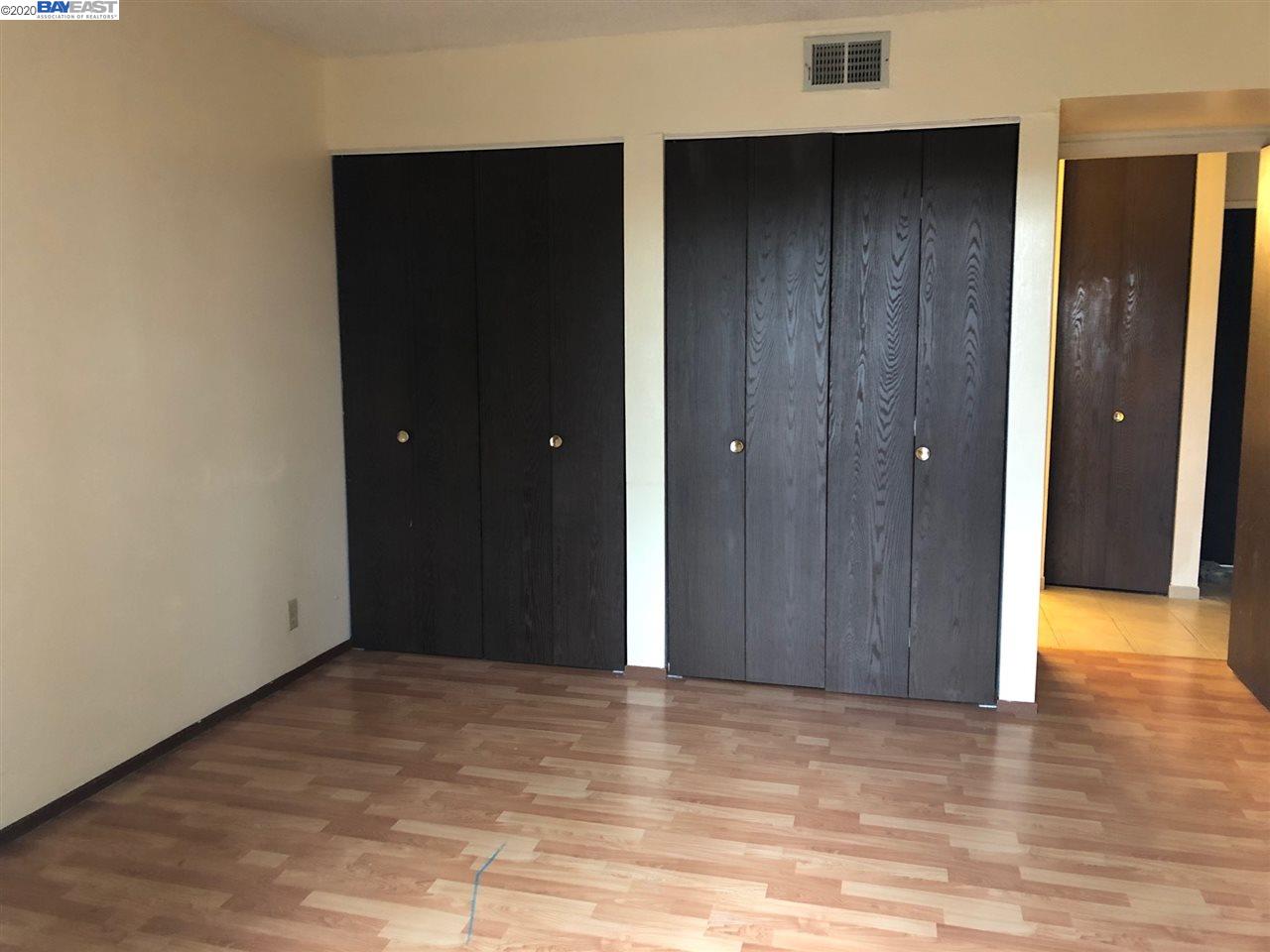 25717 Spring Drive Hayward, CA 94542 - Photo 5 of 13 a view of an empty room with wooden floor and closet