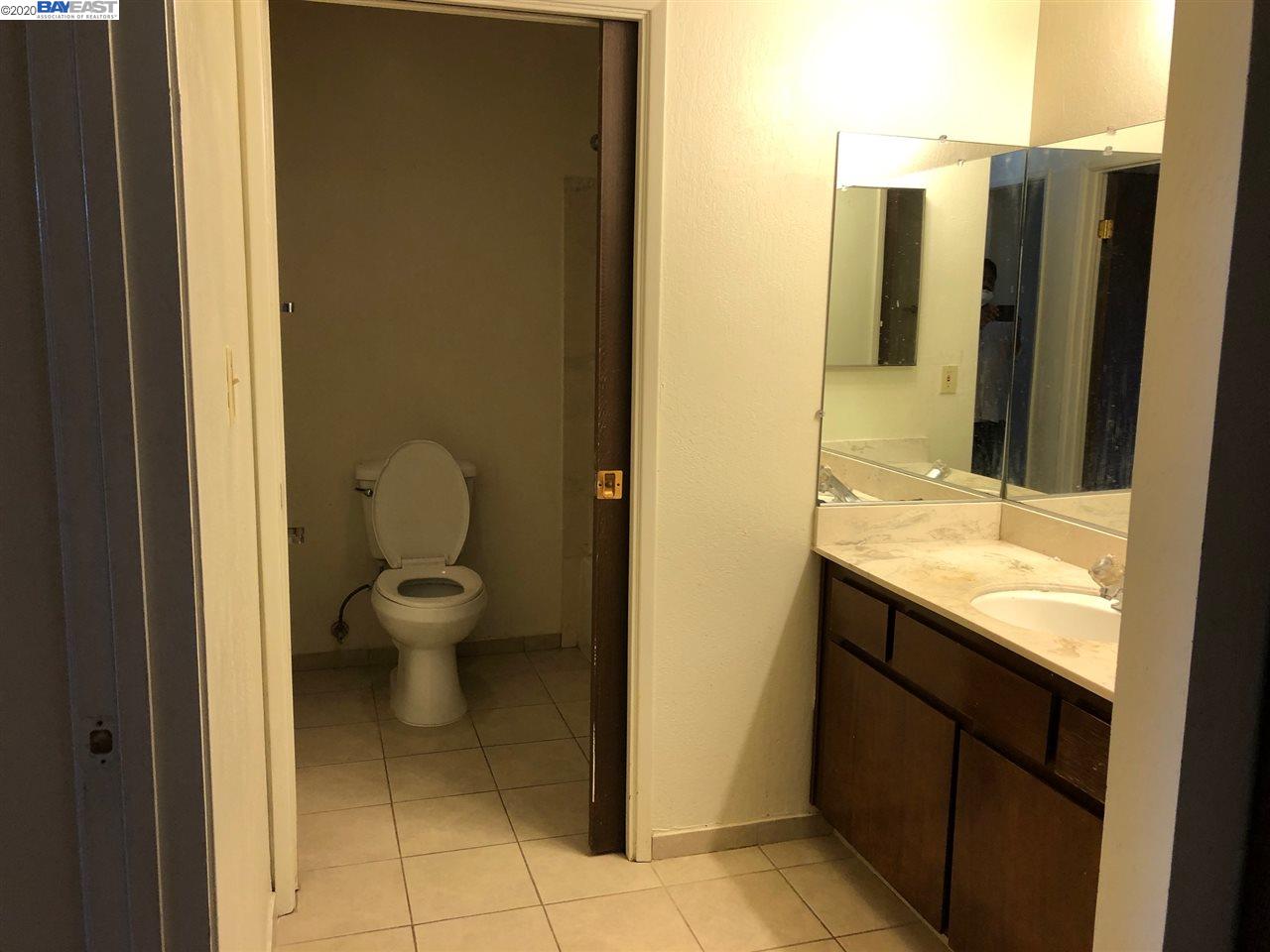 25717 Spring Drive Hayward, CA 94542 - Photo 7 of 13 a bathroom with a sink and a mirror