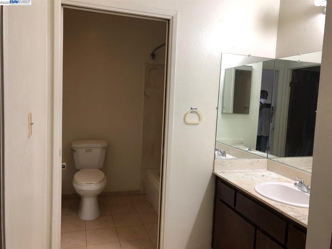 25717 Spring Drive Hayward, CA 94542 - Photo 8 of 13 a bathroom with a granite countertop sink toilet and shower