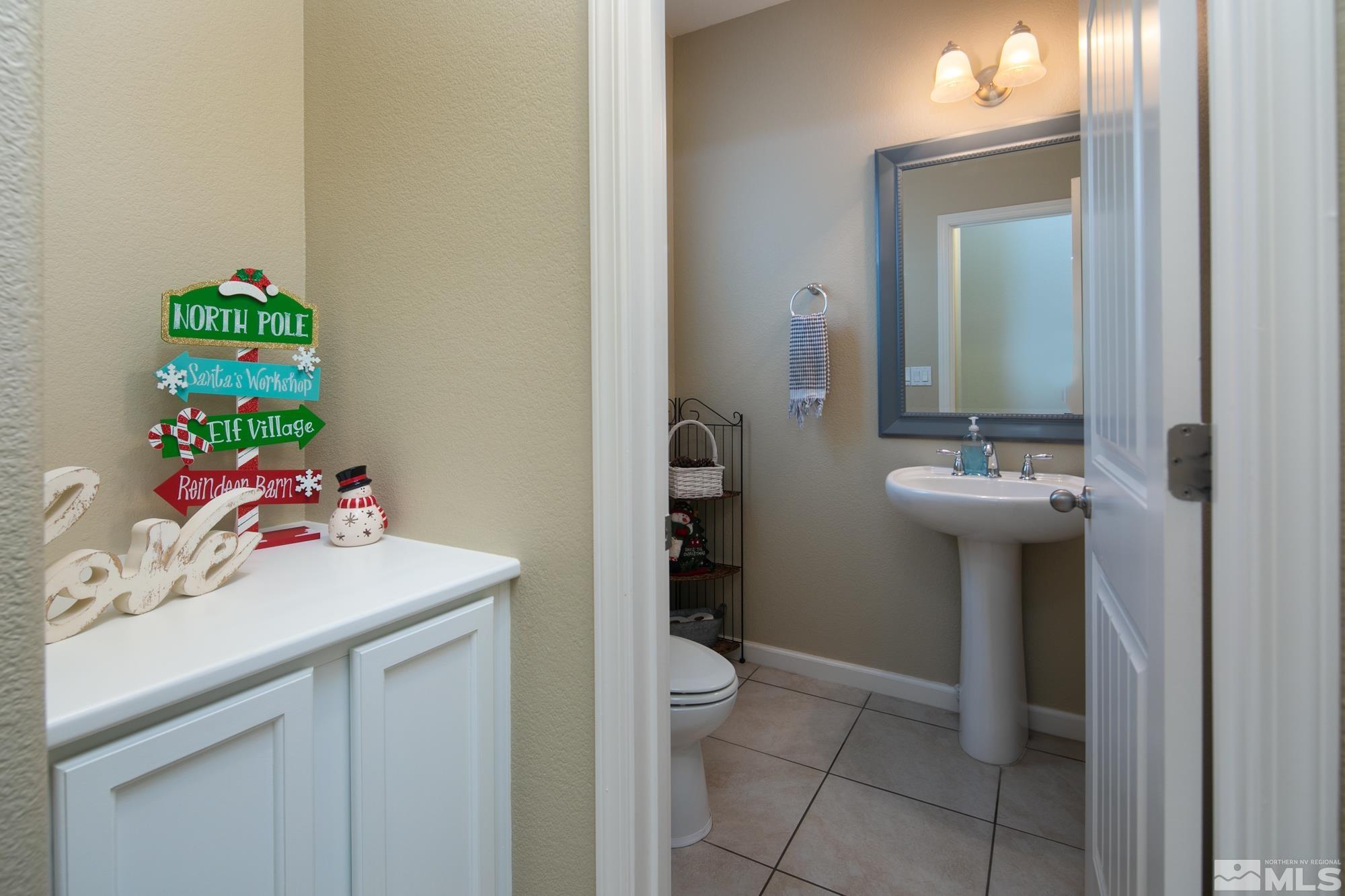 2225 Hope Valley Drive Reno, NV 89521 - Photo 24 of 31 a bathroom with a sink toilet and a mirror