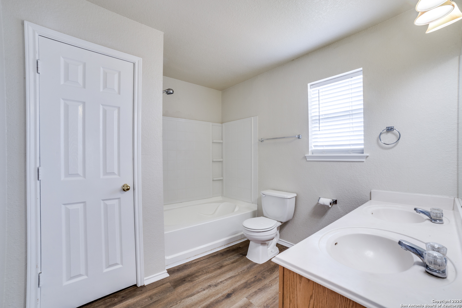 5616 Poppy Seed Run Leon Valley, TX 78238 - Photo 30 of 42 a bathroom with a sink toilet and tub