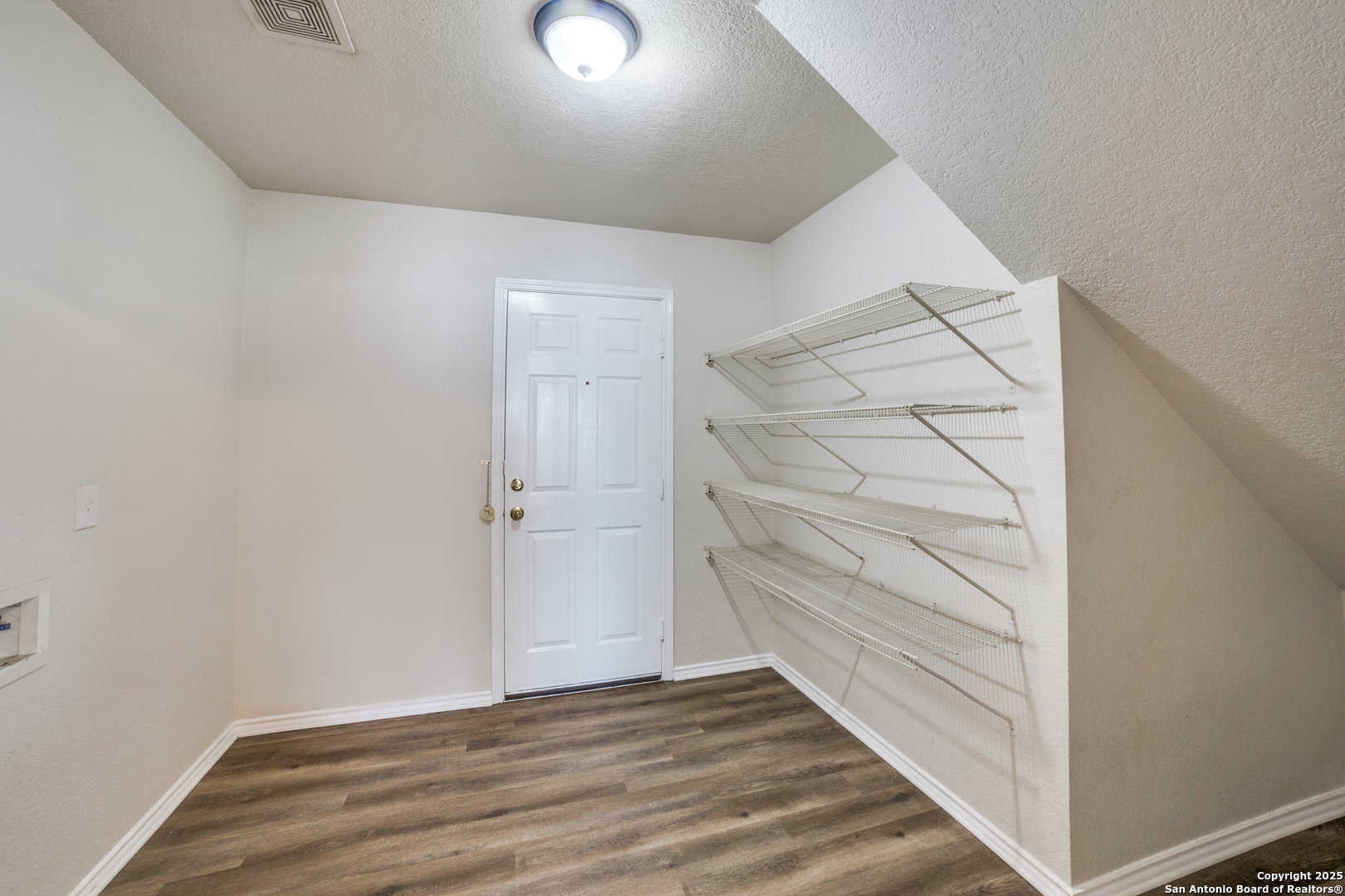 5616 Poppy Seed Run Leon Valley, TX 78238 - Photo 31 of 42 a view of an empty walk in closet