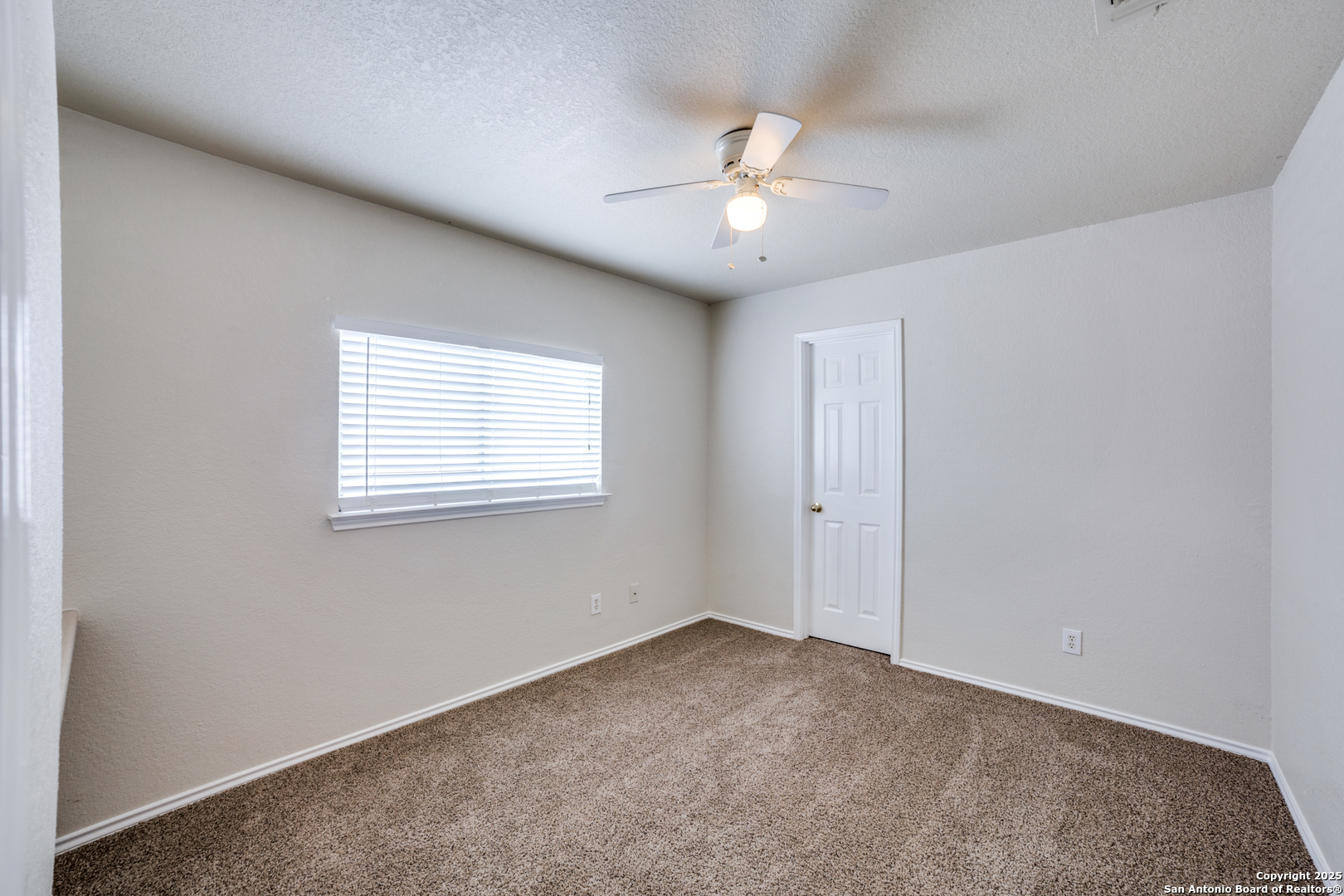 5616 Poppy Seed Run Leon Valley, TX 78238 - Photo 36 of 42 a view of an empty room with a window