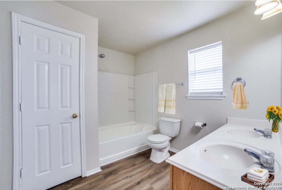 5616 Poppy Seed Run Leon Valley, TX 78238 - Photo 10 of 42 a bathroom with a sink and a bathtub