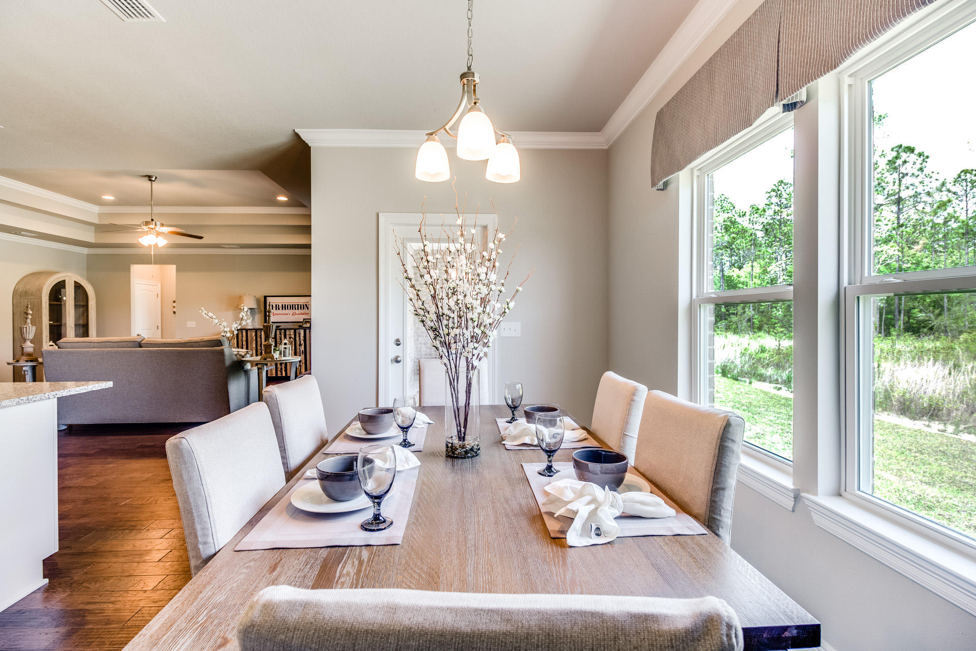 210 Conner Circle Santa Rosa Beach, FL 32459 - Photo 12 of 30 a view of a dining room with furniture wooden floor and chandelier