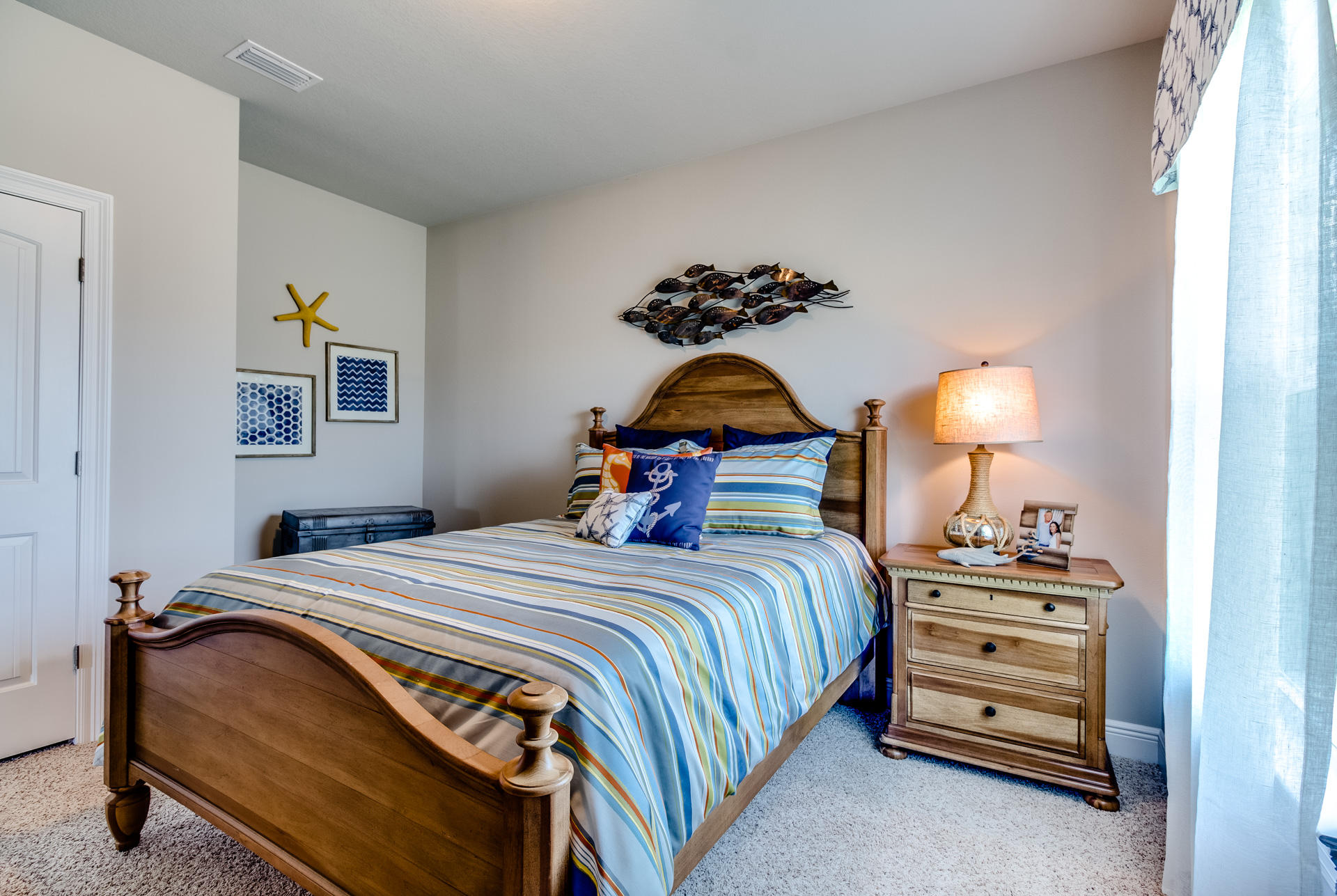 210 Conner Circle Santa Rosa Beach, FL 32459 - Photo 20 of 30 a bedroom with a bed and a lamp on the dresser