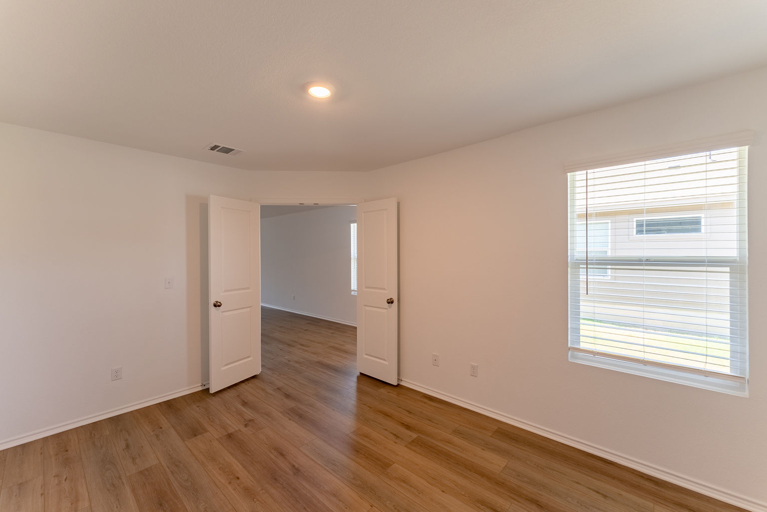 137 River Rise Road Kyle, TX 78640 - Photo 17 of 26 Unfurnished room with light wood-style flooring and recessed lighting
