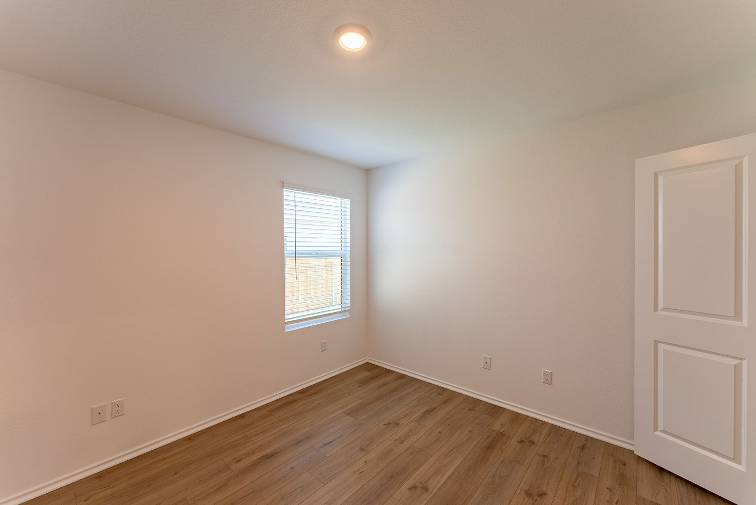 137 River Rise Road Kyle, TX 78640 - Photo 22 of 26 Spare room featuring light wood-style floors and baseboards