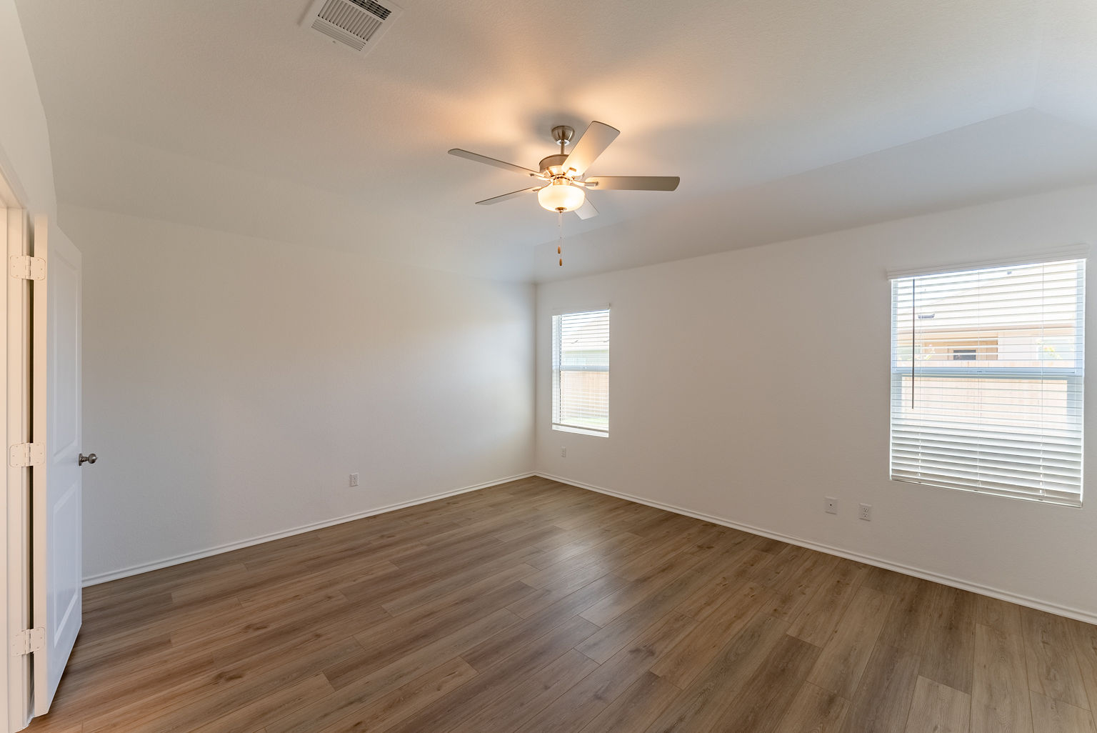 137 River Rise Road Kyle, TX 78640 - Photo 9 of 26 Unfurnished room featuring wood finished floors and ceiling fan