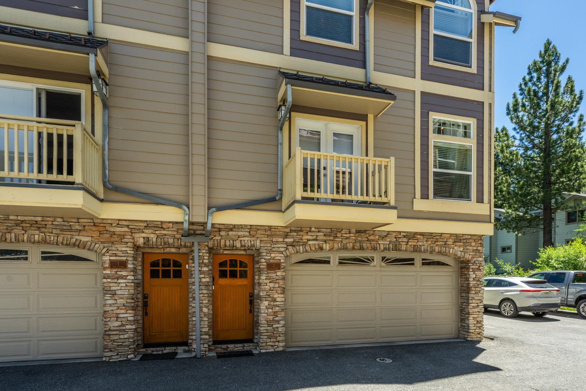 1787 Old Mammoth Road, Unit 2 Mammoth Lakes, CA 93546 - Photo 27 of 29 Multi-level exterior featuring stacked stone accents and neutral-toned siding